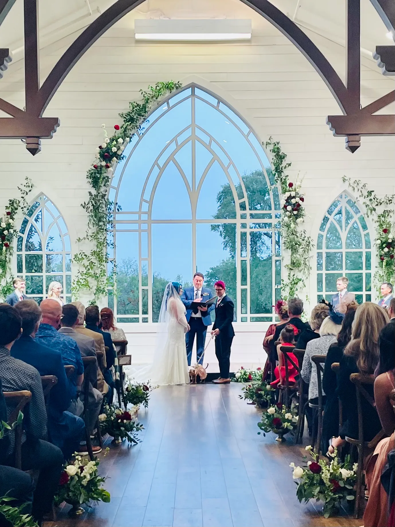 a wedding ceremony inside of a chapel