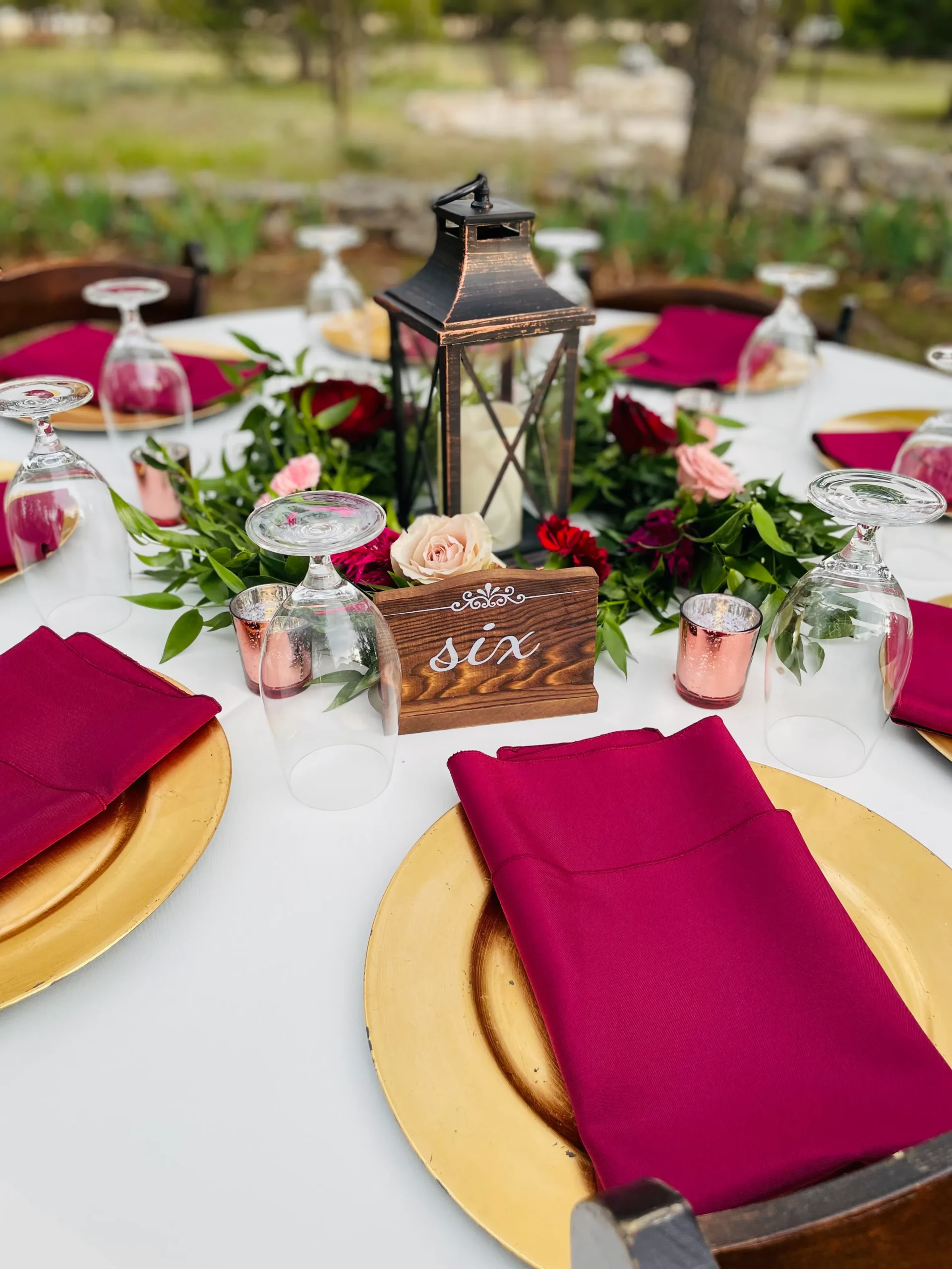 a pink and gold wedding reception table setting