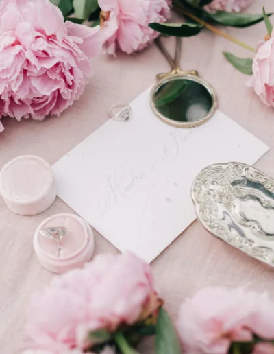 a pink collection of wedding day details