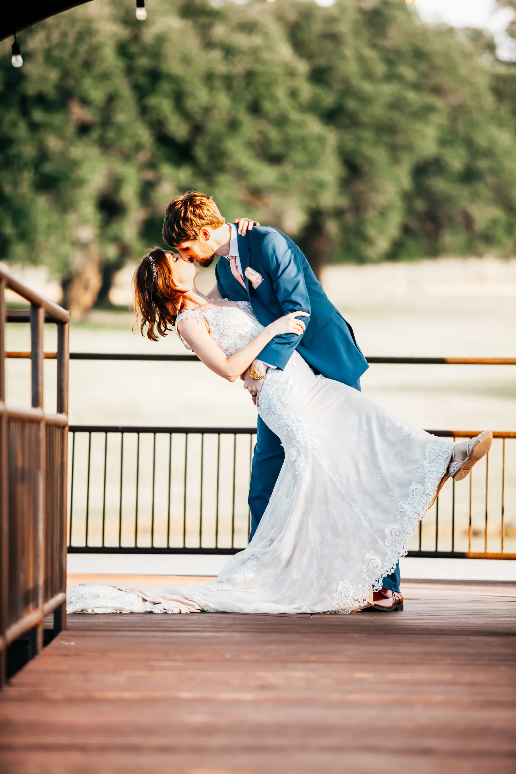 a groom dips his bride