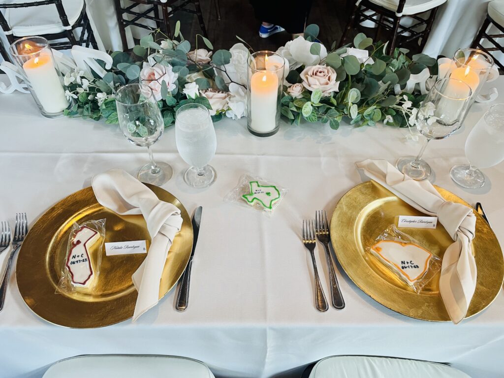 Gold plates on a dinner table set for a wedding reception