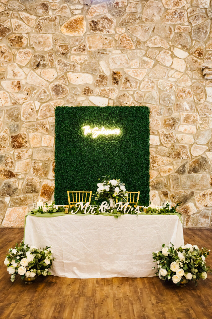 a sweetheart table at a wedding reception for a married couple