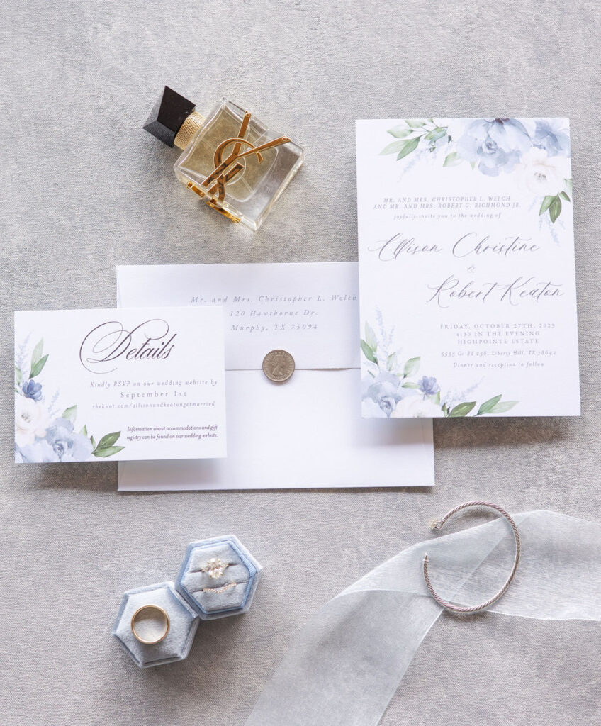 a blue-themed wedding invitation suite