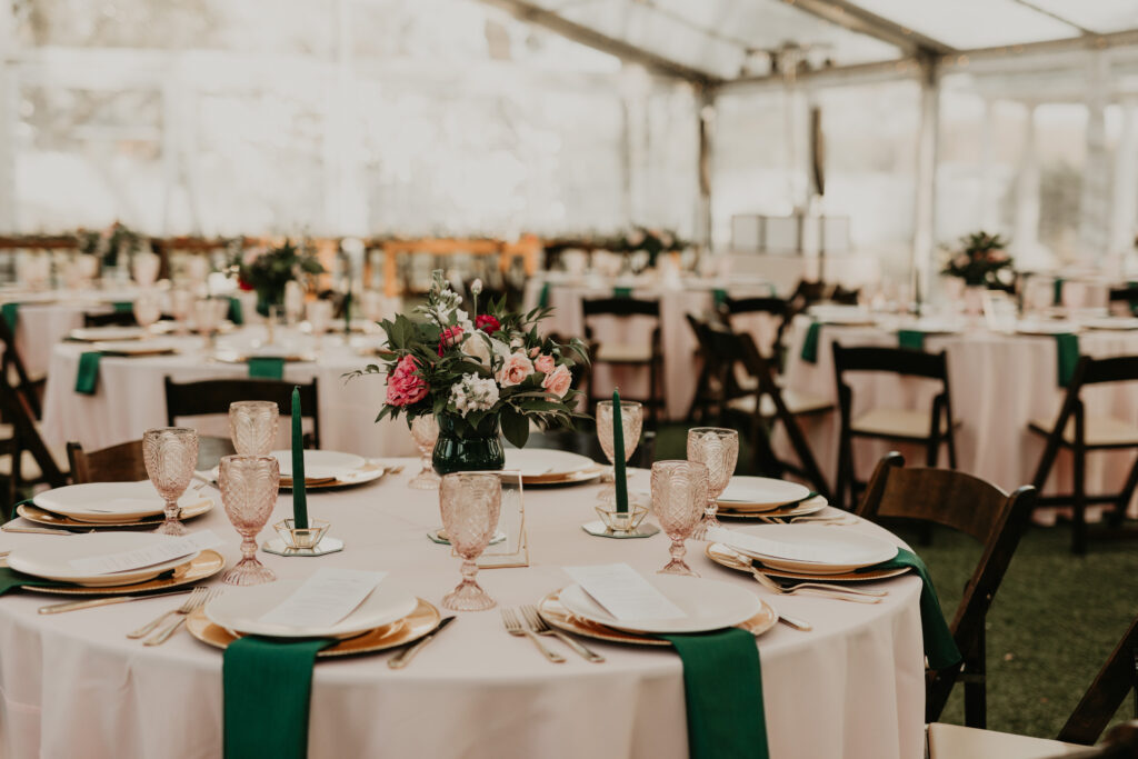 a wedding reception set up with tables, linens, and chairs